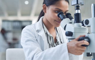 Person using a microscope.