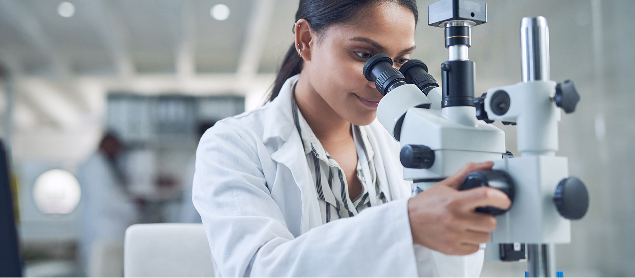 Person using a microscope.